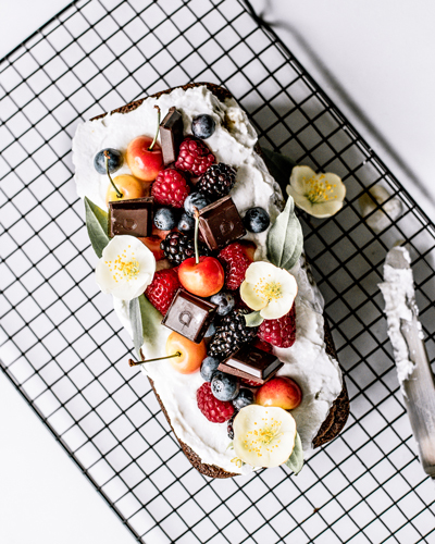 Healthy Ginger Loaf with Coconut Whipped Cream, Summer Berries & Chocolate